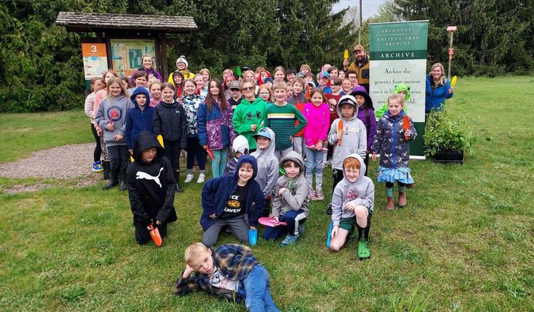 Students who planted Archangel Champion Tree clones along the boardman river